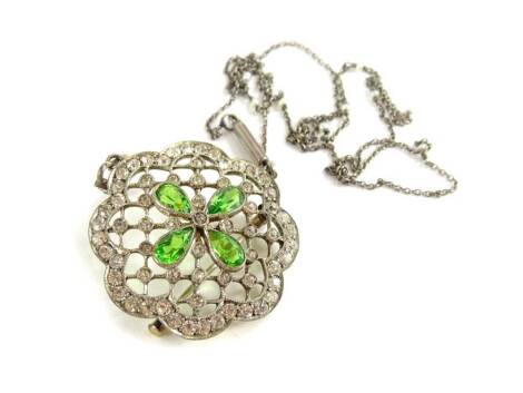 Two items of Victorian style jewellery, comprising a silver necklace with seed pearl inserts, a silver framed paste stone set pendant/ brooch, in Belle Epoque type style, set with white paste and green stones, the pendant 4cm wide, 4cm high, (2).