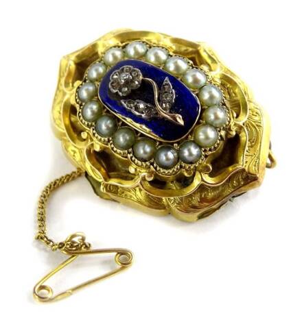 A Victorian memorial brooch, the front with three layer design, with central blue enamel panel, with raised flower with marcasite stones, surrounded by grey coloured cultured pearls, with pleated design floral border, to the back an open panel, bearing in