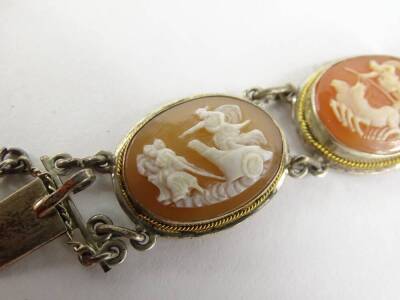 An early 20thC cameo bracelet, set with seven oval cameos depicting chariot riders at battle in various scenes, in a silver setting stamped 900, each cameo 2cm x 1.5cm, the bracelet 19cm overall, in a Seamandile of Naples box. - 2