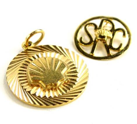 Shell Fuel Company interest. Two items of jewellery, comprising a Shell Company pendant medallion, marked to rear 2LMANHRSP.D. refinery 1985, yellow metal unmarked, and a SRC 18ct gold pendant marked 3MILL.MAN HRS1987, 11.8g all in, (2).