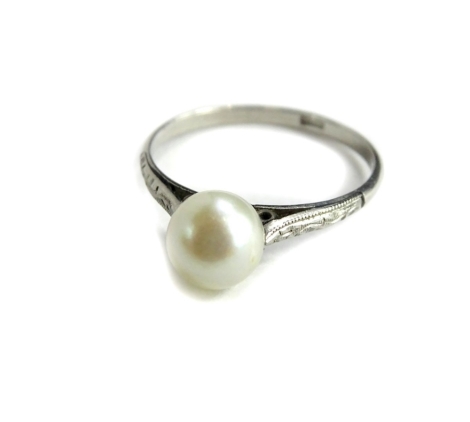 A cultured pearl dress ring, with single cultured pearl, in tension setting, with scroll design shoulders, white metal, bearing stamp WCN, unmarked, ring size O, 1.2g all in.