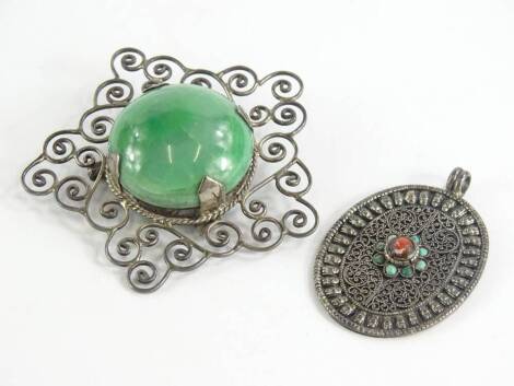 Two items of silver jewellery, comprising a silver star design scroll brooch, with green central hard stone, in four claw setting stamped to rear Mexico Silver, and an Eastern style pendant, set with turquoise and red stone, with filigree design decoratio