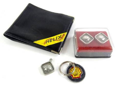 Shell Fuel Company interest, comprising a pair of Selangor pewter Malaysia shell cuff links, a 1986 Long Service Award presentation pendant for Shell Fuel, a similar pendant on key chain, boxed, a Helix The Living Oil Launch 24th November '85 gentleman's 