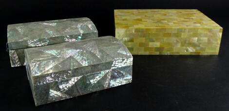 Three Eastern mother of pearl inlaid boxes, to include two similar, each with a domed lid.