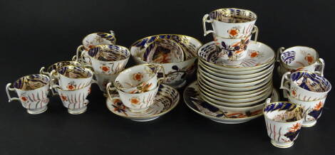 A 19thC Spode part tea and coffee service, decorated with flowers, leaves, etc., in Imari colours, to include two sizes of cups, saucers and a plate.