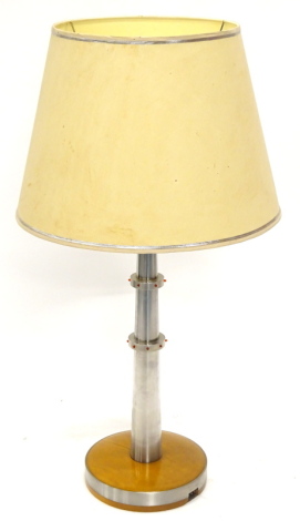 An unusual steel and hardwood table lamp, inset with red LED type lights, on a circular base, 110cm high. By repute made at the Rolls Royce factory.