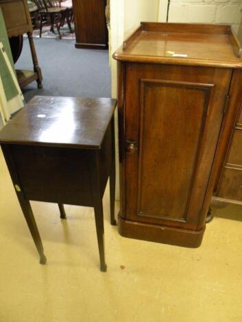 A Victorian mahogany pot cupboard with a raised back and panel