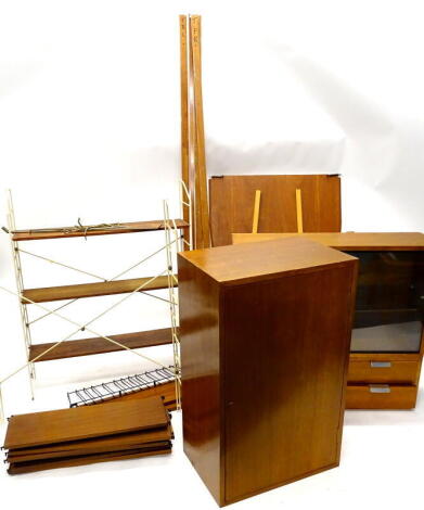 A quantity of 1960's-70's teak Ladderax type units, with various wooden supports, to include a fall front section with piano hinge and parquetry door, sections with aluminium drawers etc.