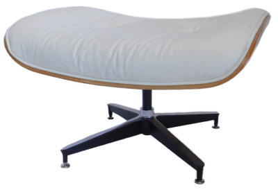 A rosewood and cream leather stool, after a design by Charles and Ray Eames, rectangular top on a black tubular metal base, with 'X' shaped support, 66cm wide.