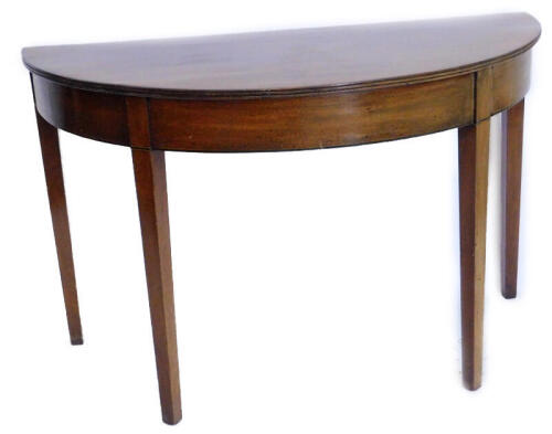 A 19thC mahogany demi lune table, with a reeded edge on square tapering legs, 114cm wide.