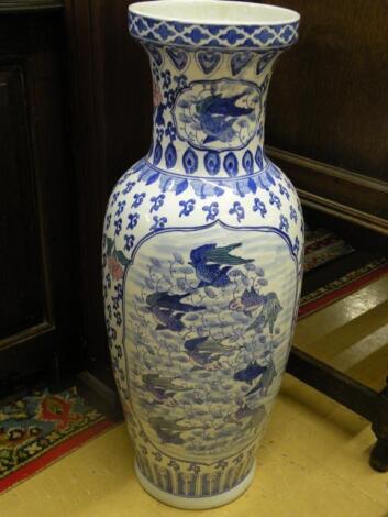 A large Chinese porcelain vase decorated with fish