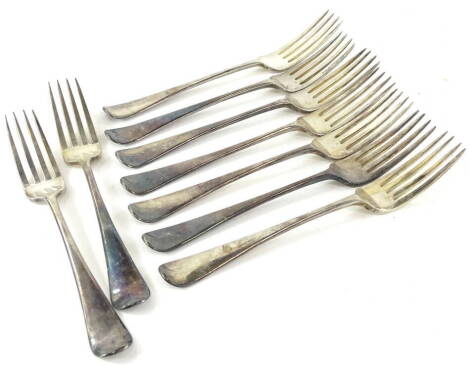 An associated set of nine silver Old English pattern dessert forks, each engraved with initial R, 21oz.