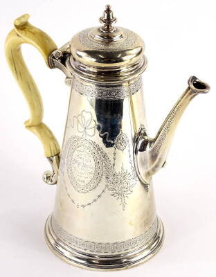 A George II silver coffee pot, of tapering form, later engraved overall with ribbons, leaves and flowers, inscribed 'presented to the Honourable and Reverend Evelyn Monson by Lord and Lady Monson Aug 7th 1860,' with a shaped ivory handle, London 1731, mak