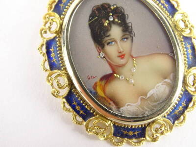 An oval painted brooch of a maiden, the maiden wearing a stone set necklace, tiara and earrings, in enamel decoration on white ceramic back, with a floral and blue enamel filigree design with a pendant loop top and single pin back, yellow metal, stamped 7 - 2