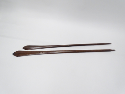 Two Tribal club paddles, one blackened to flat end, possibly South Sea Islands, 148cm x 133cm long. Provenance: By repute a gift from Lady Sheffield, Normanby Hall, Lincolnshire. - 2