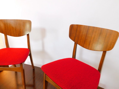 A Nathan teak draw leaf dining table, with one additional leaf, raised on tapering square legs, together with six single dining chairs.The upholstery in this lot does not comply with the 1988 (Fire & Fire Furnishing) Regulations, unless sold to a known ex - 2