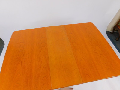 A G-Plan teak drop leaf dining table, 73cm high, 30.5cm wide, 137cm extended, 91cm deep., together with four single dining chairs. (5)The upholstery in this lot does not comply with the 1988 (Fire & Fire Furnishing) Regulations, unless sold to a known exp - 4