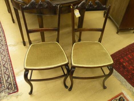 A pair of Edwardian mahogany bedroom chairs