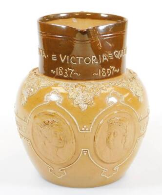 A Royal Doulton Queen Victoria Jubilee stoneware jug, in two colours raised with medallions of the Young and Old profiles, slip decorated with Lasting God She Wrought Her People, with beak spout and strap handle, impressed marks beneath, 17cm high. - 2