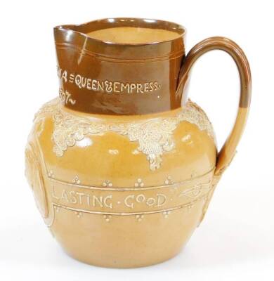 A Royal Doulton Queen Victoria Jubilee stoneware jug, in two colours raised with medallions of the Young and Old profiles, slip decorated with Lasting God She Wrought Her People, with beak spout and strap handle, impressed marks beneath, 17cm high. - 3