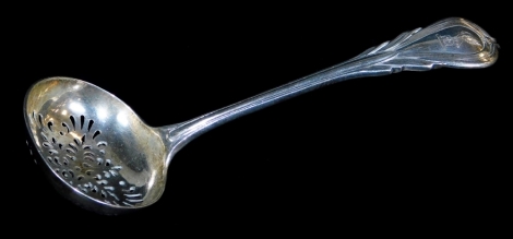 A Victorian silver sifter spoon, with feather crested and fluted handle, and pierced oval bowl, London 1892, 16cm wide, 2oz.