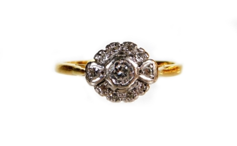 An 18ct gold dress ring, florally set with small diamonds, size M-N, 2.5g all in.