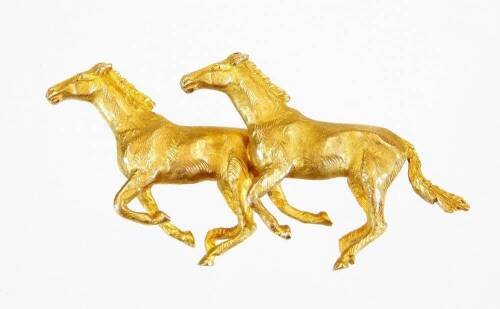 A 9ct gold double horse brooch, styled as two prancing horses, with plain pin back, 5cm wide, 19g all in.