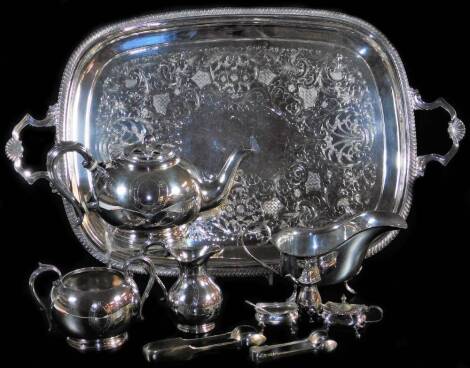 Various silver plated ware, an oval tea tray with shaped shell capped handles, 61cm wide, large sauce boat, bullet shaped teapot, sugar bows, matched cruet set, etc. (a quantity)