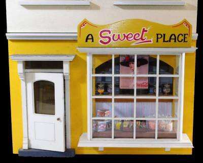 An Anglesey doll's house sweet shop, with articulated front, with shop interior to the lower section, stamped to back, 76cm high, 39cm wide, 37cm deep. - 2