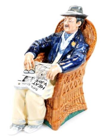 A Royal Doulton figure Taking Things Easy HN2677, printed marks beneath, 18cm high.