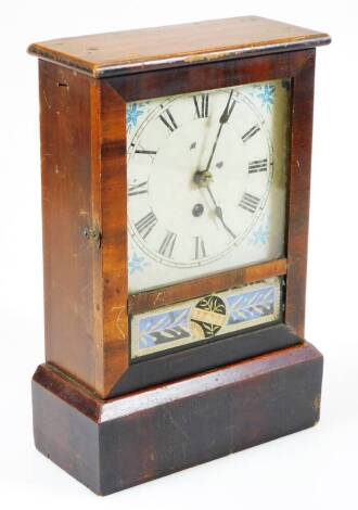 An early 20thC Cottage No. 2 walnut and pine cased timepiece, the decorative glazed front revealing a 13cm wide plate with Roman numeric stencilling and floral spandrels, with enclosed movement, with pendulum, 30cm high. (AF)