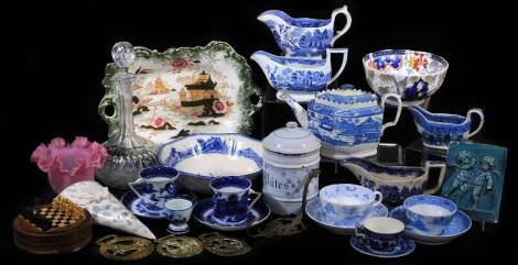 Various 19thC pottery, blue and white early Castleford diamond shaped teapot, transfer printed with scene, other blue and white, glass decanter, gravy boats, pink glass shade, other pottery and effects, cherub plaque, brassware to include horse brasses, e