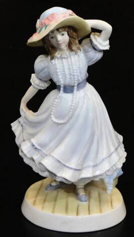 A Royal Worcester National Children's Home Compton and Woodhouse figure Grandma's bonnet, limited edition no. 33292/9500, printed marks beneath, 20cm high. (in associated box)