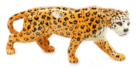 A 20thC Beswick figure of a standing leopard, printed marks beneath, 13cm high.