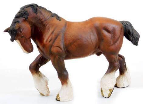 A 20thC Beswick matt finish figure of a large standing shire horse, right leg up, marked beneath, 22cm high.