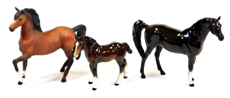 A 20thC Beswick matt finish figure of a prancing horse, left leg up, 18cm high and two other horse figures. (3)