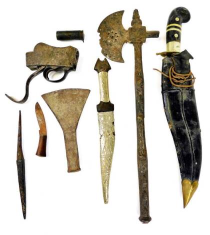 Various weaponry and effects, etc., a Khukri with shaped blade, axe, 47cm wide, a silvered dagger with scabbard, a pin fire shot gun cartridge, axe head, etc. (a quantity)