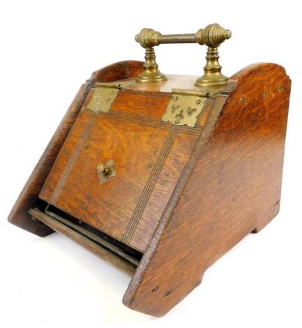 An early 20thC oak coal box, with brass hinges and fixed handle, 39cm high.