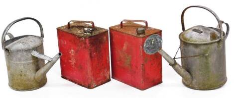 Two vintage fuel cans, of rectangular form with fixed handles painted red with shaped lids, one marked Valor, 35cm high and two zinc galvanized watering cans. (4)