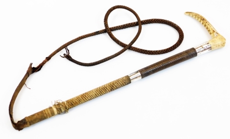 A leather hunting whip, with horn top double silver collar, London 1925, and turned handle, the main body 51cm wide.