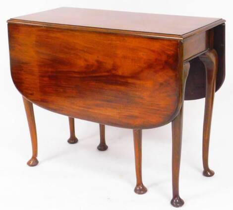 A 19thC mahogany drop leaf table, the plain rounded top raised on turned legs terminating in pad feet, when closed 75cm high, 89cm wide, 46cm deep.