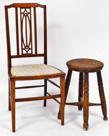 An Edwardian mahogany salon chair, with embroidered seat on square tapering front legs joined by a shaped stretcher, 93cm high, and a 19thC elm four pronged stool with single moulded legs, joined by an X stretcher. (2)