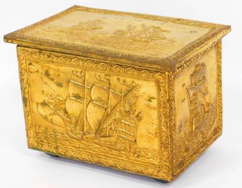 A 20thC brass slipper box, of rectangular form, the hinged lid revealing a plain interior repousse decorated with ships all around, 33cm high, 46cm wide, 31cm deep.