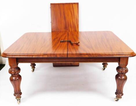 A Victorian mahogany extending wind out dining table, the moulded oblong top raised on heavy reeded legs terminating in castors, with winder, when closed 75cm high, 153cm wide, 120cm deep, with single leaf 53cm wide.