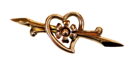 A 9ct gold brooch, of arrow heart and floral form with a plain pin back, 4cm wide, 2g all in.