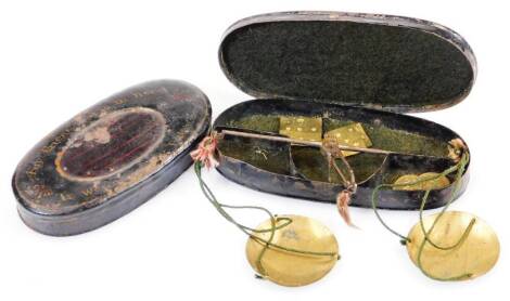 An early 19thC snuff box, of oval form with any friend that is in need motto, a set of Georgian steel pocket scales and Japan tin box titled Justice 14cm wide. (2)