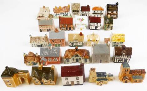 Twenty seven various pottery cottages, castles, 6cm high, etc. (27)