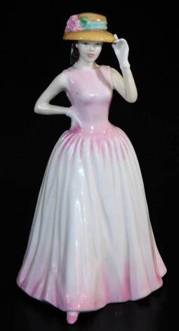 A Royal Doulton figure Happy Birthday 2000, HN425, printed marks beneath, 23cm high.