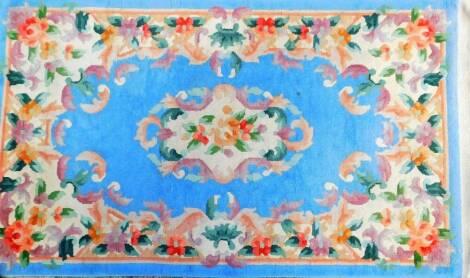 A Chinese blue patterned rug, in floral pattern, 160cm x 91cm.