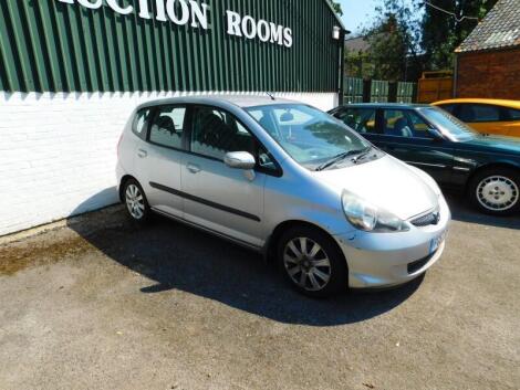 A Honda Jazz, registration FG57 KDO, silver, battery flat, last recorded mileage at service on 7/11/2018 69,209 miles, first registered 27th September 2007, 5 door, 1339cc, petrol, last MOT expired 24th November 2019, sold with V5, full service history an